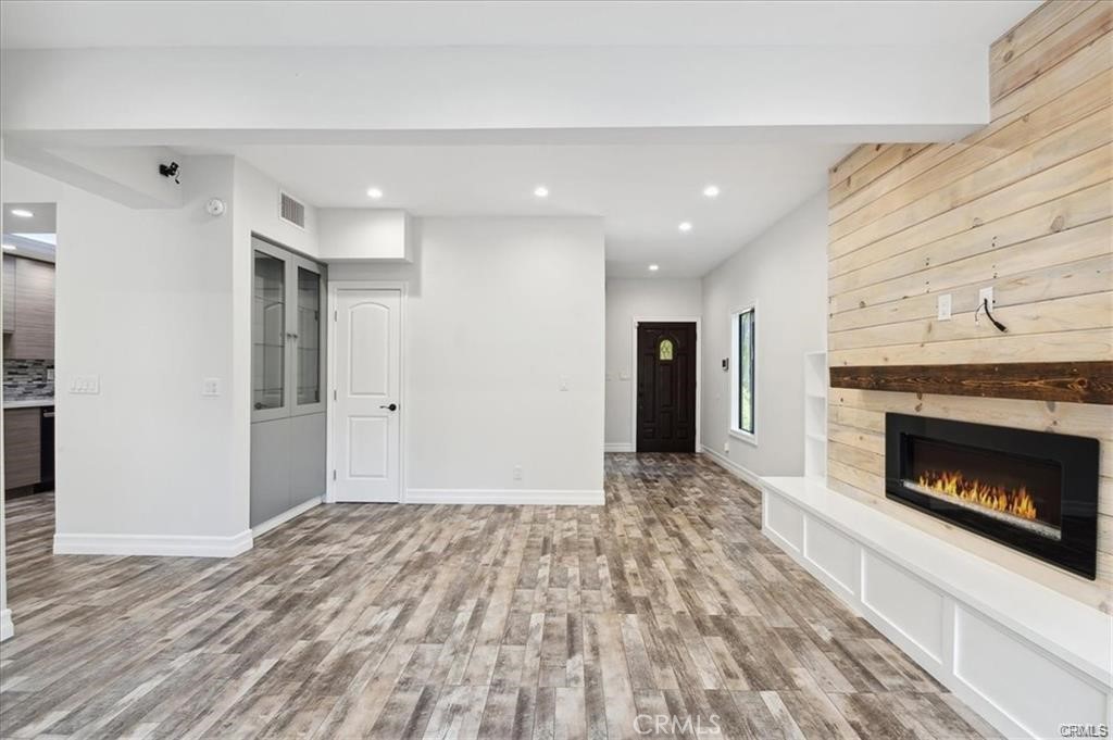 10831 Roycroft Street, Unit 72 Sun Valley, CA 91352 - Photo 10 of 33 a view of an empty room and fire place