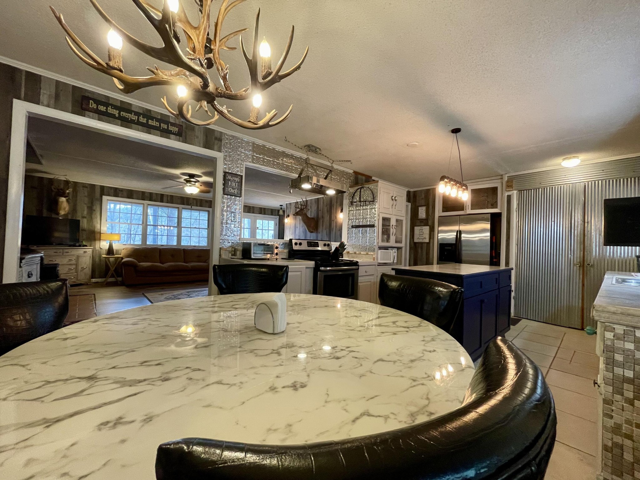 1522 Turkey Creek Road Tellico Plains, TN 37385 - Photo 3 of 34 a large kitchen with a table and chairs