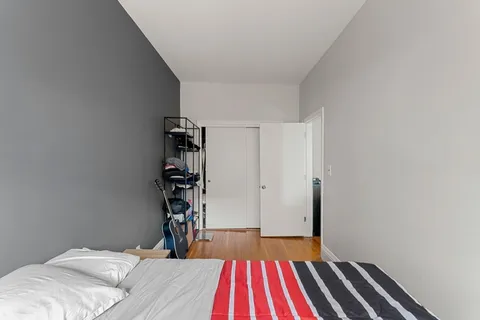 a room with a bed and a chandelier