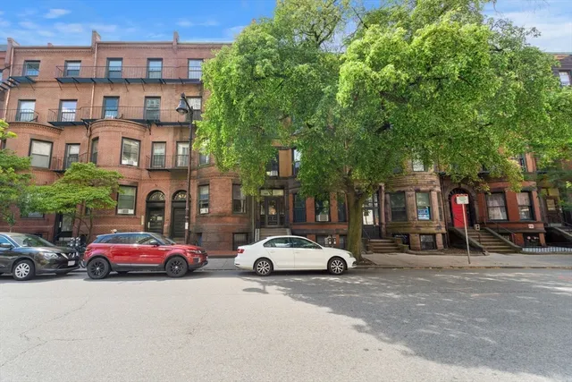 a cars parked in front of a building