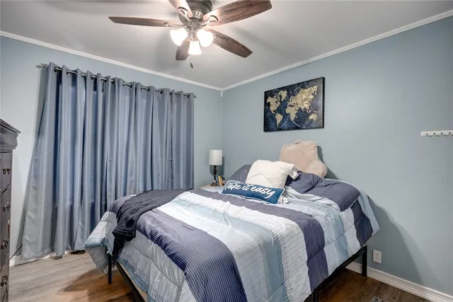 a bedroom with bed and a window