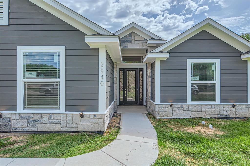 2940 Henry Road Lancaster, TX 75134 - Photo 2 of 10 a front view of a house with garden