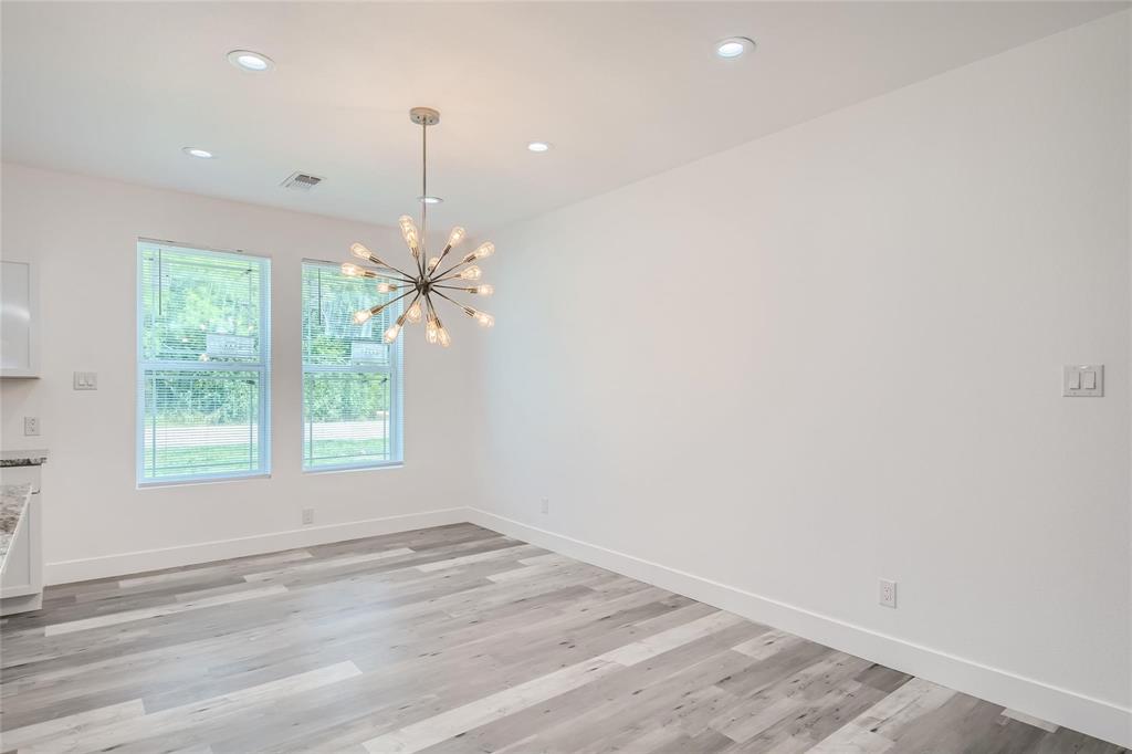 2940 Henry Road Lancaster, TX 75134 - Photo 6 of 10 en empty room with windows and ceiling fan