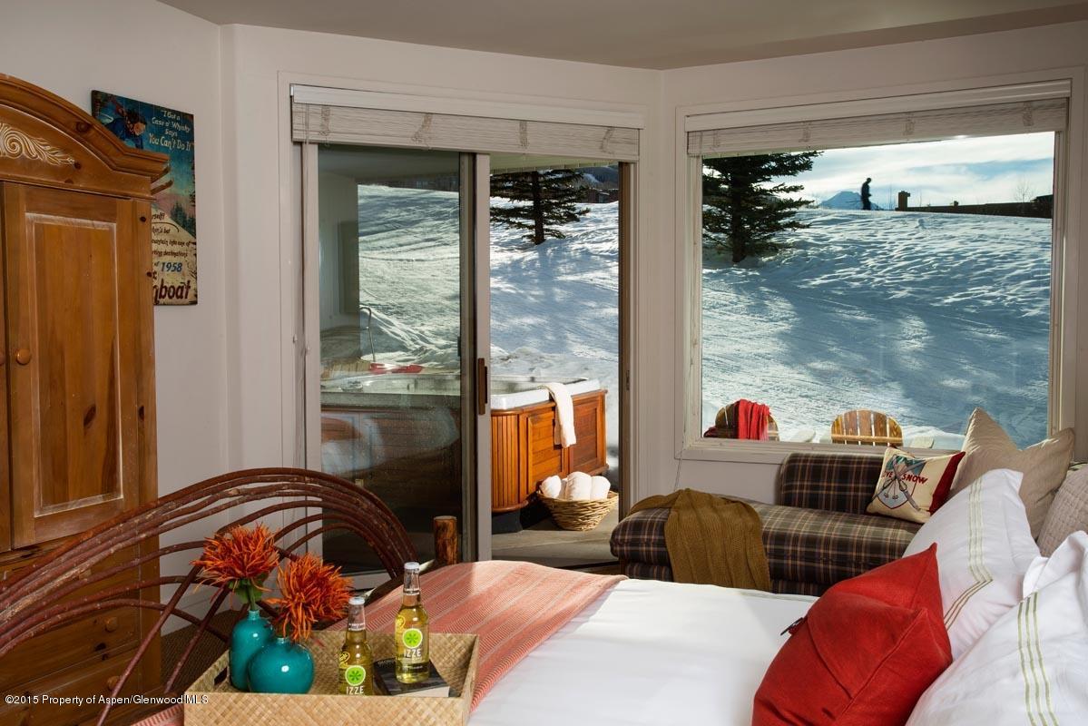 381 Ridge Road, Unit B3 Snowmass Village, CO 81615 - Photo 11 of 18 a living room filled with furniture and a floor to ceiling window