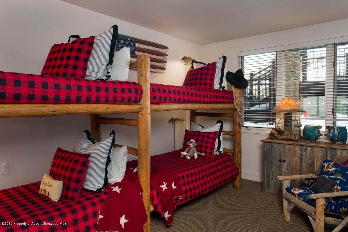 381 Ridge Road, Unit B3 Snowmass Village, CO 81615 - Photo 12 of 18 a bedroom with furniture and a bed