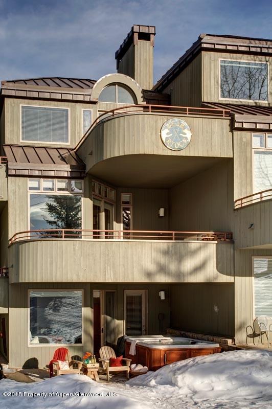 381 Ridge Road, Unit B3 Snowmass Village, CO 81615 - Photo 15 of 18 a view of a building with car parked