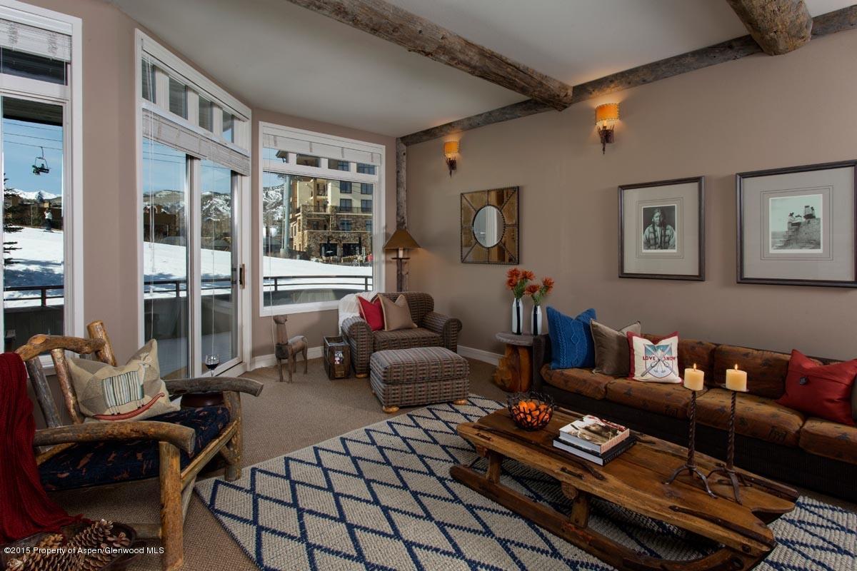 381 Ridge Road, Unit B3 Snowmass Village, CO 81615 - Photo 2 of 18 a living room with furniture and a floor to ceiling window