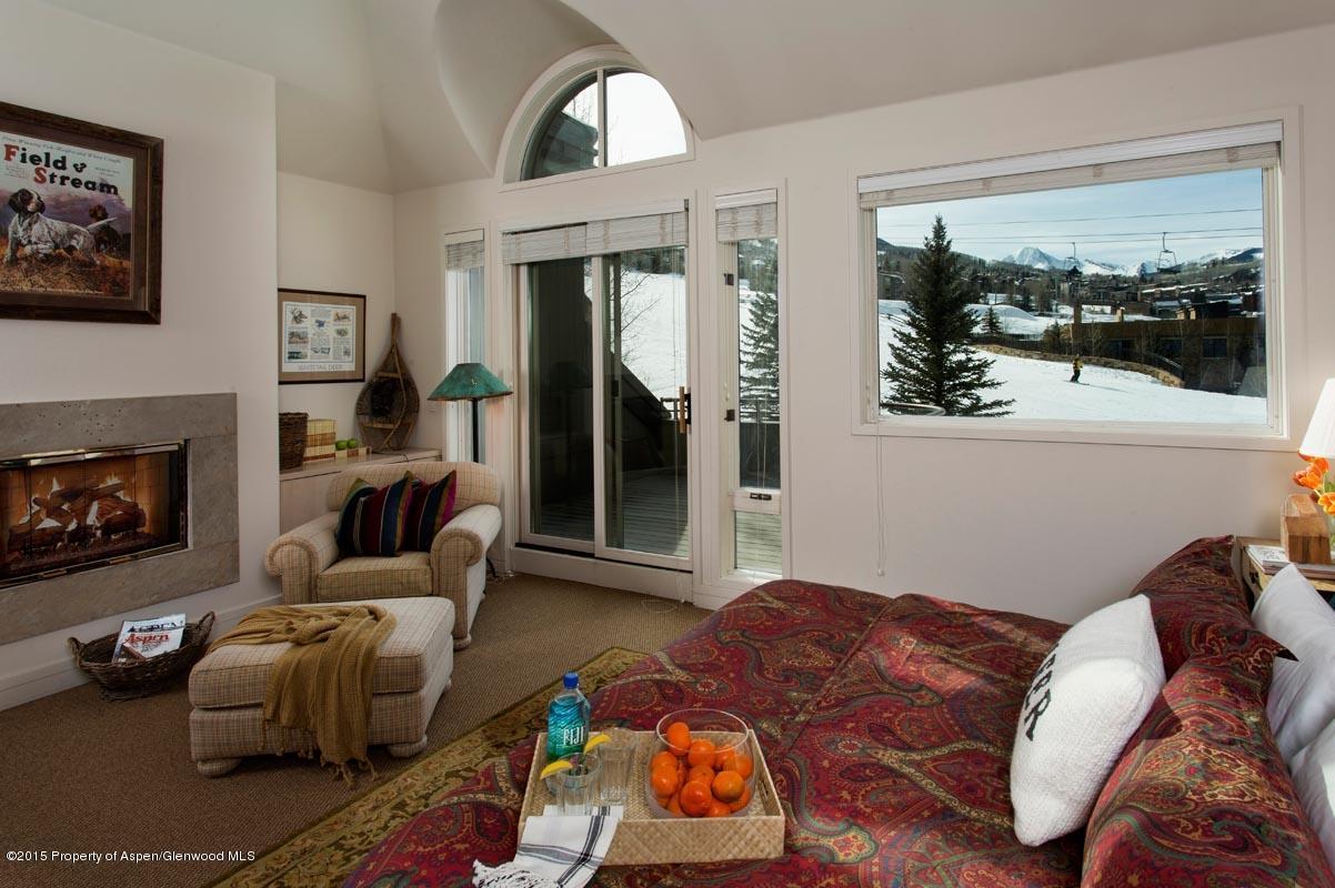 381 Ridge Road, Unit B3 Snowmass Village, CO 81615 - Photo 8 of 18 a living room with furniture and a fireplace