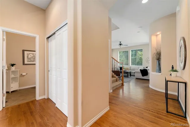 a view of a livingroom with furniture and floor to ceiling window