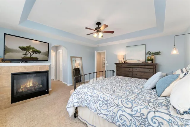 a bedroom with a bed and a fireplace