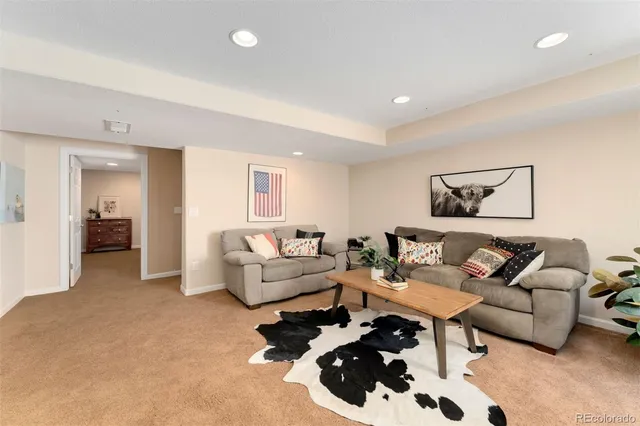 a living room with furniture and a table