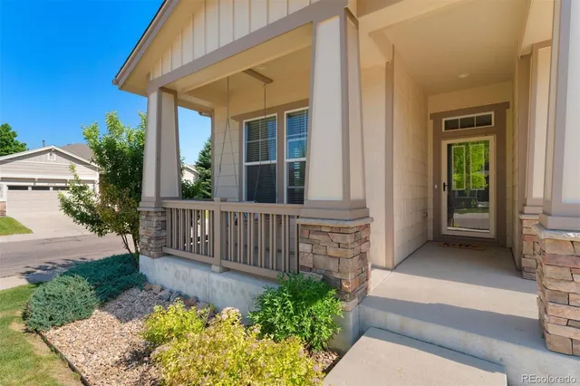 a view of a house with wooden fence