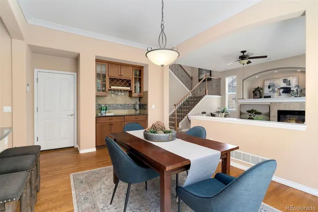 a view of a dining room with furniture and wooden floor