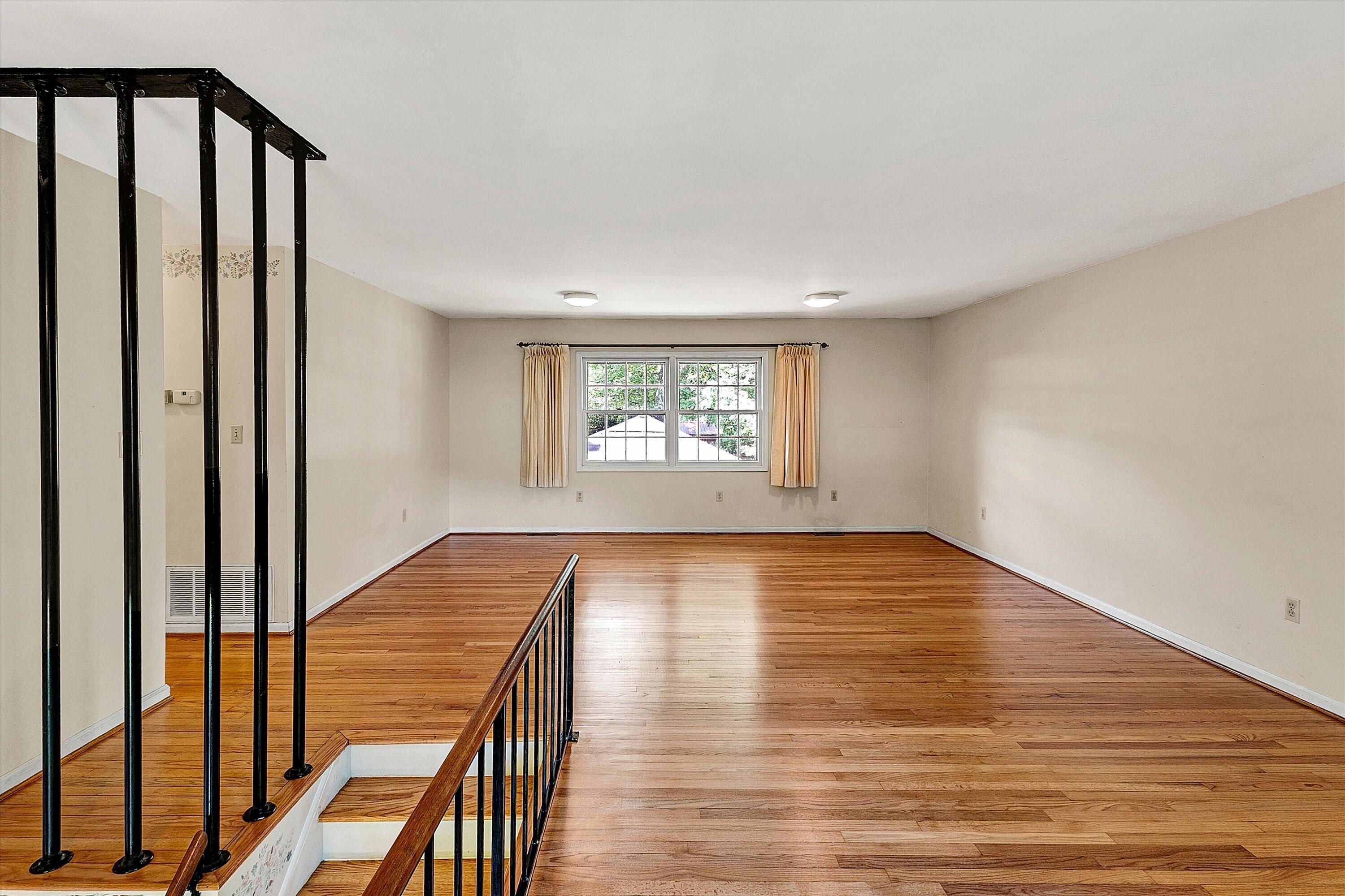 912 Cherokee Trail Covington, VA 24426 - Photo 4 of 31 a view of an empty room with wooden floor and a window