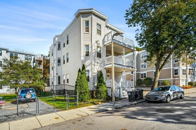 a view of a street with cars