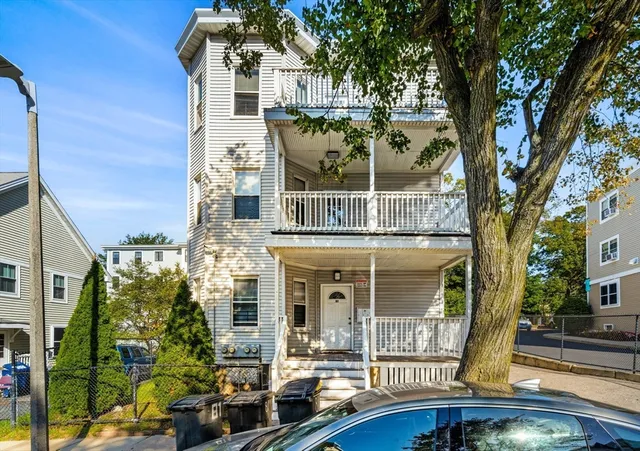 front view of a building with a garden