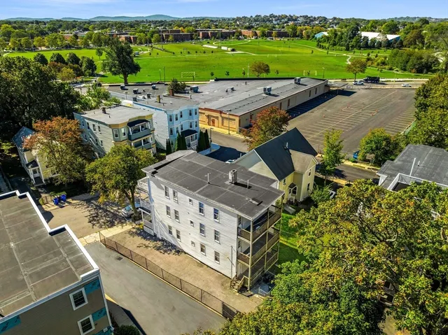 an aerial view of a house with a garden