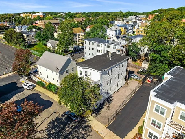 an aerial view of a house with a garden