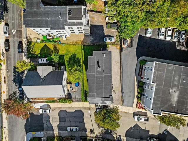 aerial view of a house with a yard