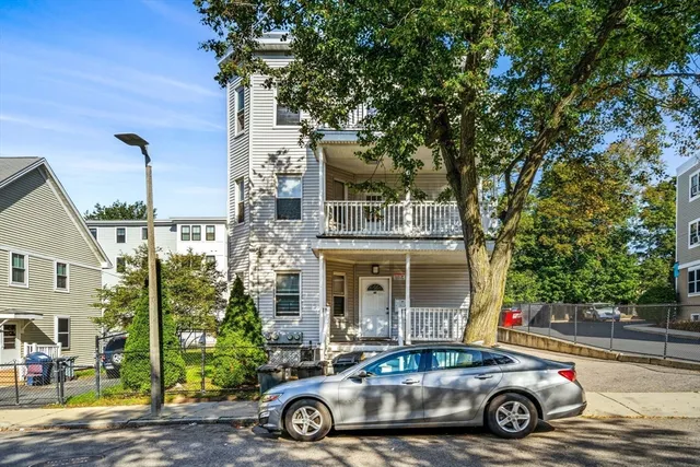 a car parked in front of a house