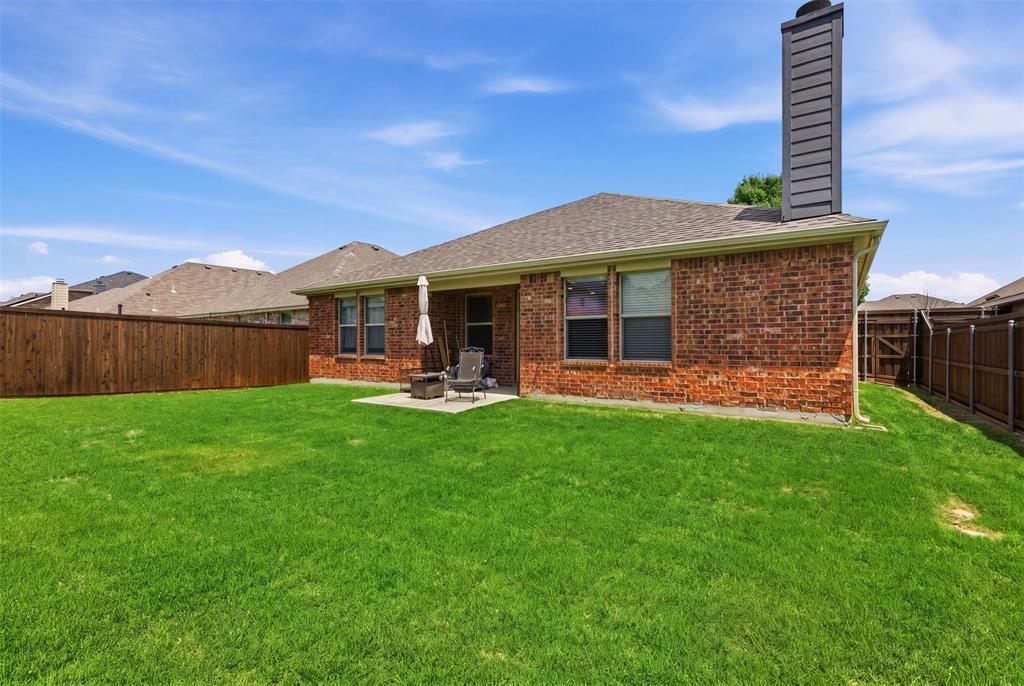 5491 Exeter Drive Prosper, TX 75078 - Photo 2 of 20 a front view of a house with garden
