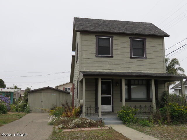 313 West Walnut Avenue Lompoc, CA 93436 - Photo 1 of 12 a front view of a house with garden