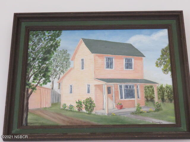 313 West Walnut Avenue Lompoc, CA 93436 - Photo 12 of 12 a front view of a house with a yard