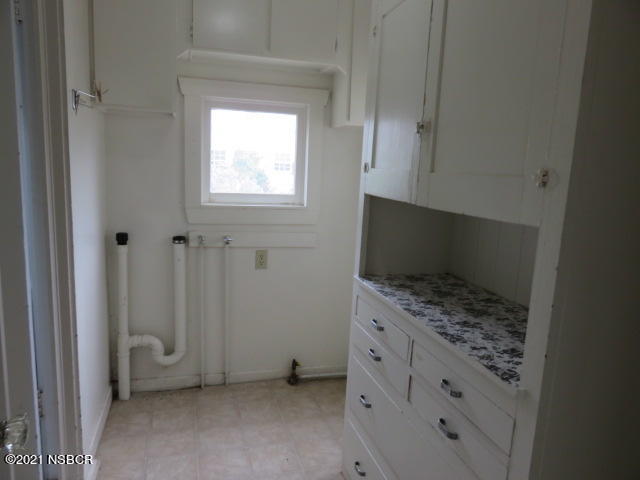 313 West Walnut Avenue Lompoc, CA 93436 - Photo 6 of 12 a bathroom with a granite countertop window and a sink