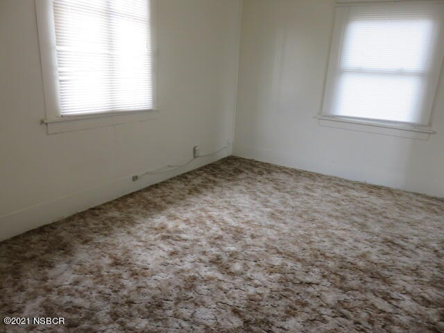 313 West Walnut Avenue Lompoc, CA 93436 - Photo 10 of 12 an empty room with a window