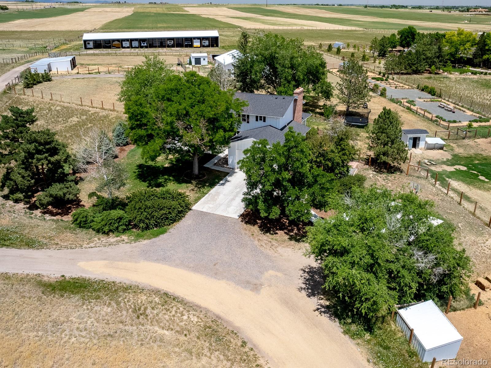 9625 Phillips Road Lafayette, CO 80026 - Photo 40 of 40 an aerial view of a house with a yard basket ball court and outdoor seating
