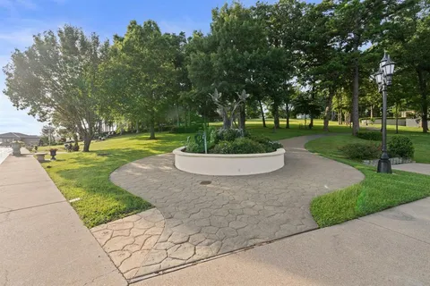 a view of a house with a patio and a car parked