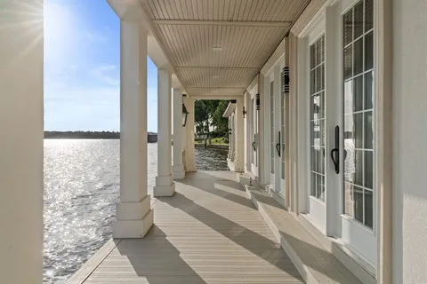 a big yard with lots of trees in the background