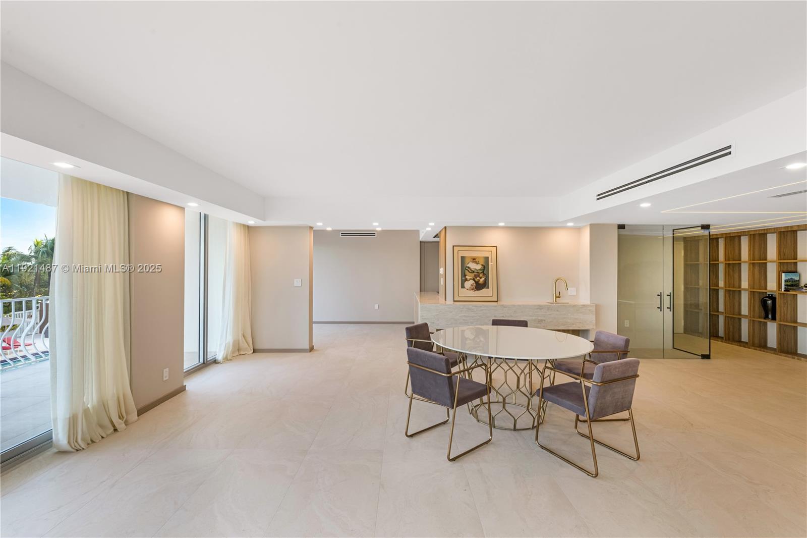 10155 Collins Avenue, Unit 202 Bal Harbour, FL 33154 - Photo 14 of 50 a view of a livingroom with furniture and window