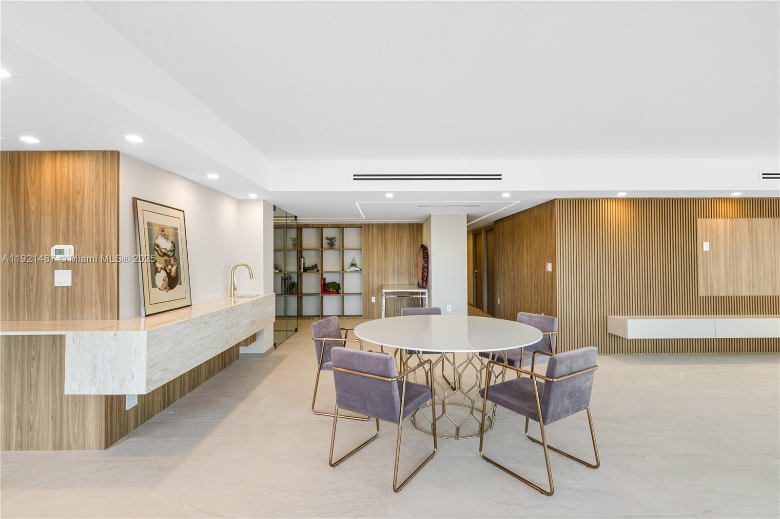 10155 Collins Avenue, Unit 202 Bal Harbour, FL 33154 - Photo 26 of 50 a dining room with furniture and window