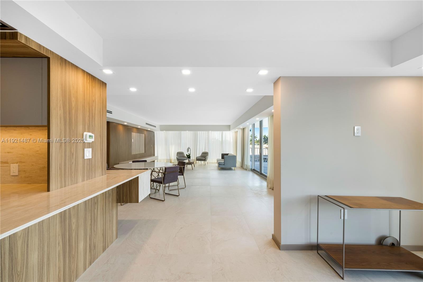 10155 Collins Avenue, Unit 202 Bal Harbour, FL 33154 - Photo 28 of 50 a view of a living room kitchen and a sink