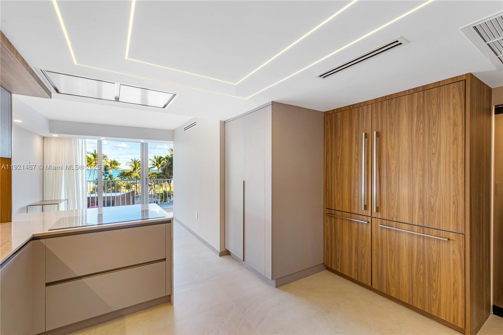 10155 Collins Avenue, Unit 202 Bal Harbour, FL 33154 - Photo 31 of 50 a view of kitchen with stainless steel appliances granite countertop window and front door