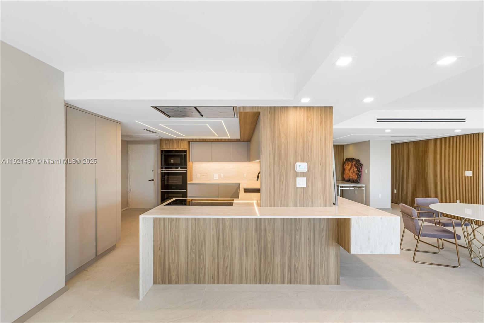 10155 Collins Avenue, Unit 202 Bal Harbour, FL 33154 - Photo 33 of 50 a living room with stainless steel appliances kitchen island granite countertop furniture and a view of kitchen