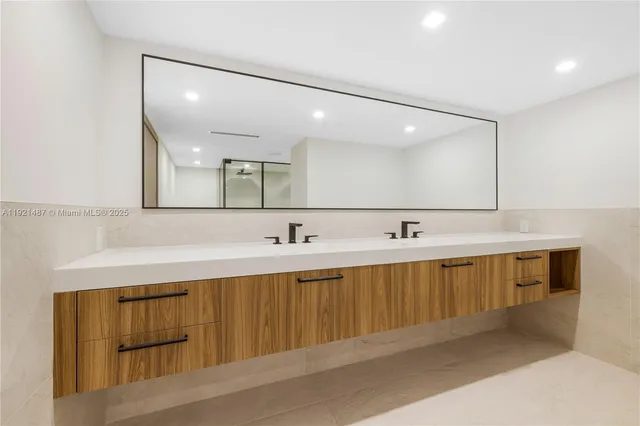 a bathroom with a shower a toilet and a shower