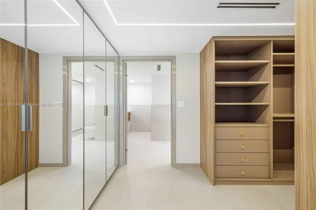 a bathroom with a sink a shower and a mirror