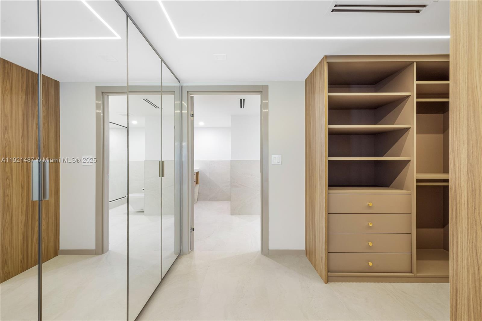 10155 Collins Avenue, Unit 202 Bal Harbour, FL 33154 - Photo 42 of 50 a view of walk in closet