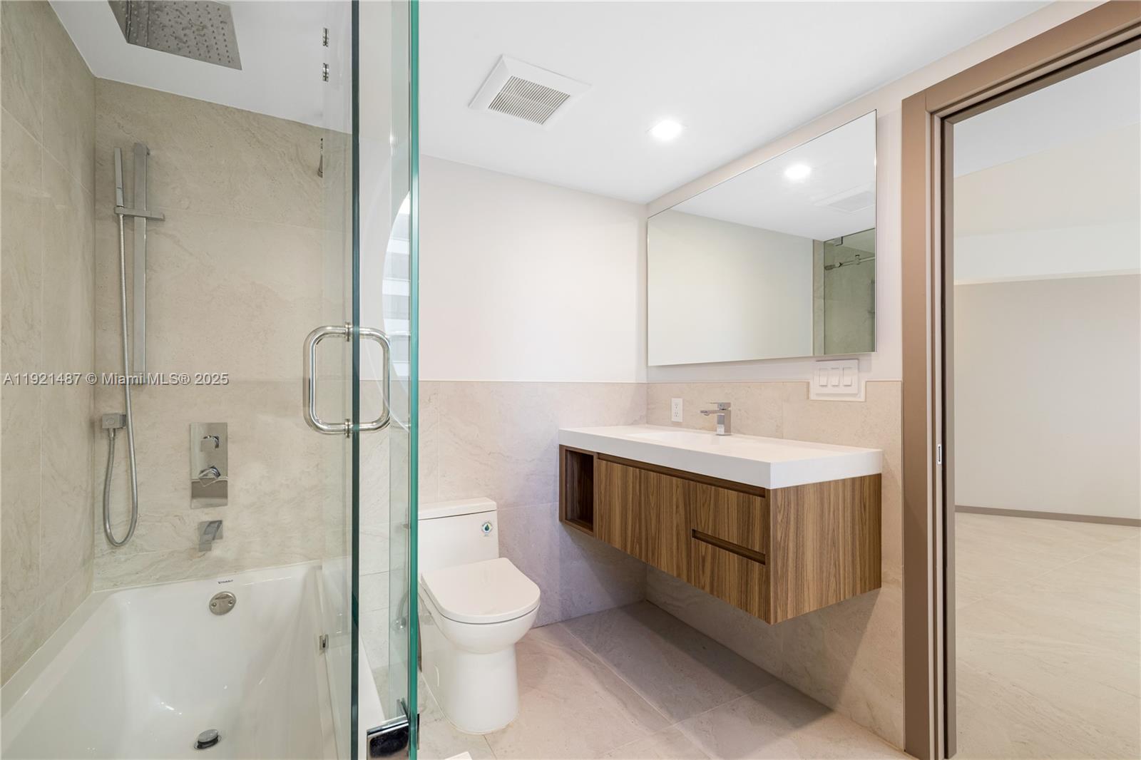 10155 Collins Avenue, Unit 202 Bal Harbour, FL 33154 - Photo 49 of 50 a bathroom with a sink a toilet and shower