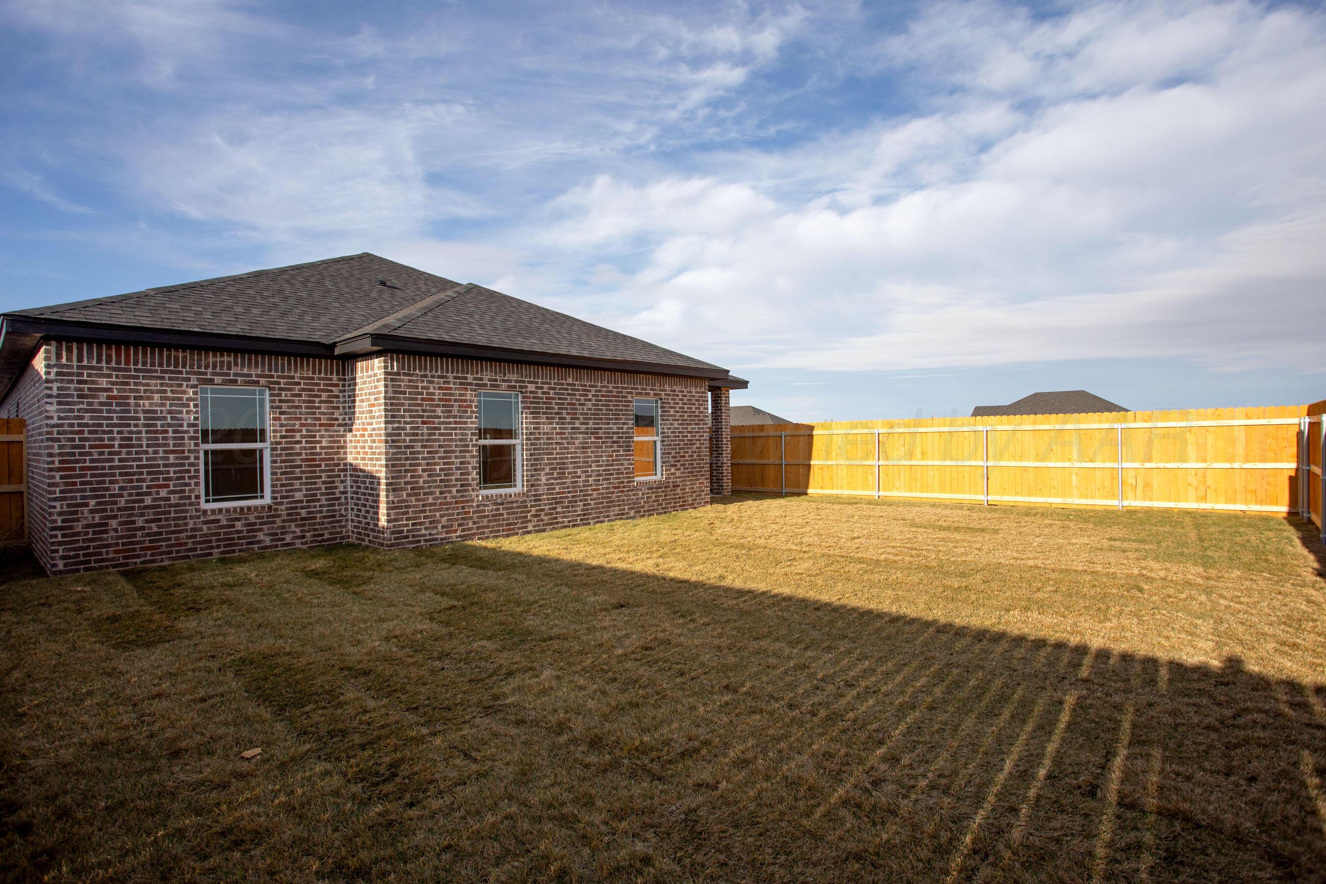 22111 Howard Draw Road Canyon, TX 79015 - Photo 24 of 25 a house with swimming pool in front of it