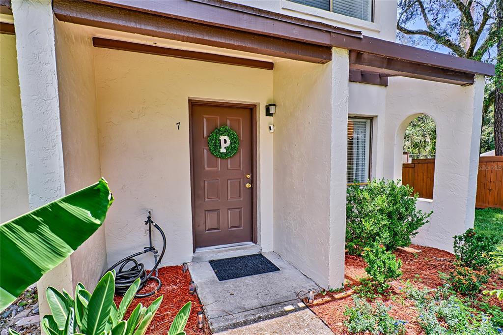 2635 Southwest 35th Place, Unit 807 Gainesville, FL 32608 - Photo 1 of 1 a front view of a house with a yard