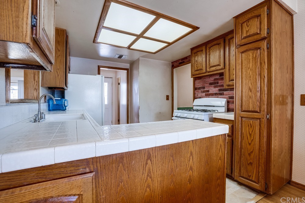 612 Lyford Drive La Verne, CA 91750 - Photo 14 of 44 a large kitchen with stainless steel appliances a large counter top