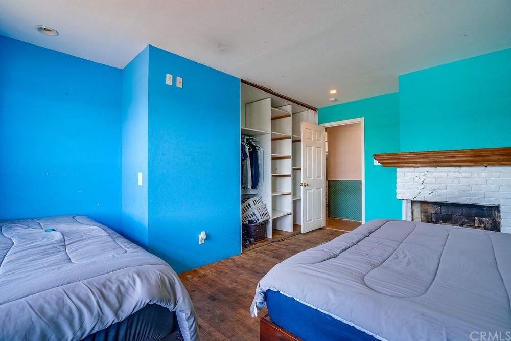 612 Lyford Drive La Verne, CA 91750 - Photo 25 of 44 a bedroom with a bed and a fireplace