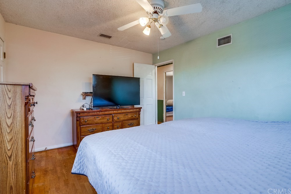 612 Lyford Drive La Verne, CA 91750 - Photo 33 of 44 a bedroom with a bed and a flat screen tv