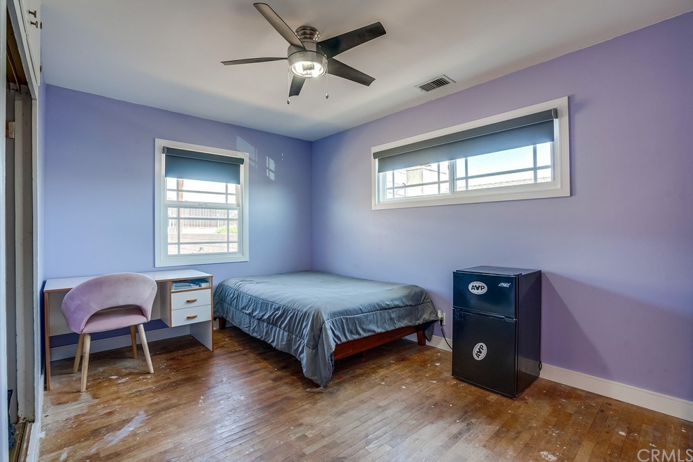 612 Lyford Drive La Verne, CA 91750 - Photo 35 of 44 a bedroom with a bed and a chandelier