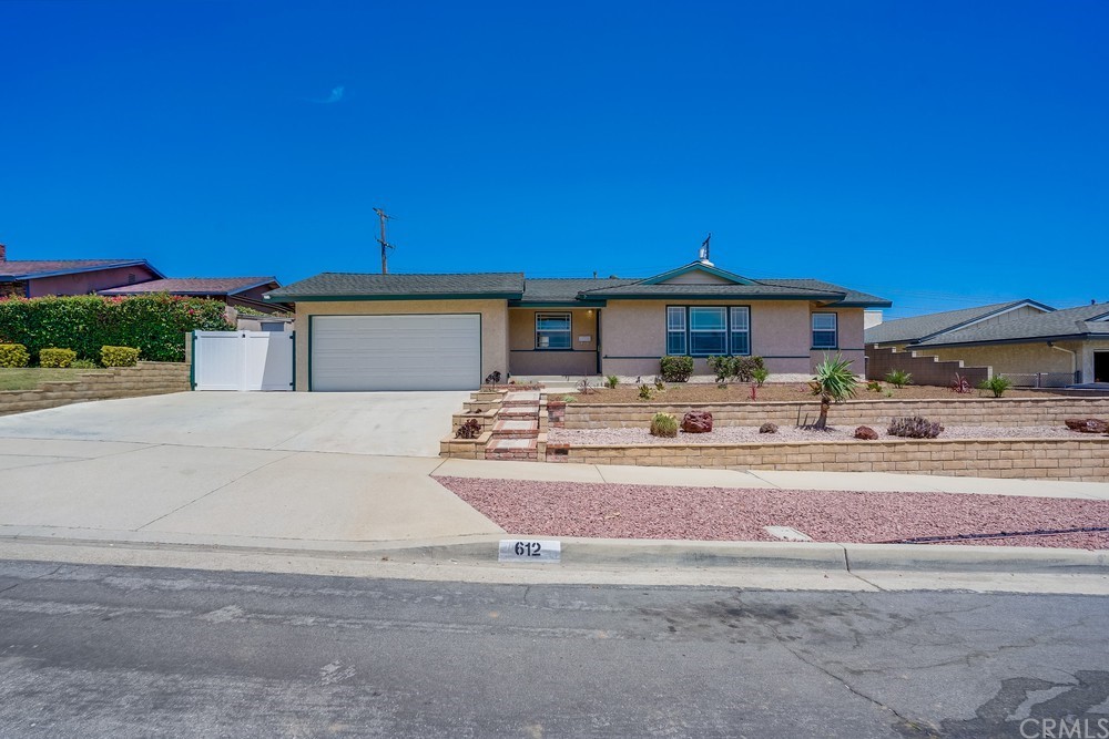 612 Lyford Drive La Verne, CA 91750 - Photo 4 of 44 a front view of a house with a yard outdoor seating and kitchen view
