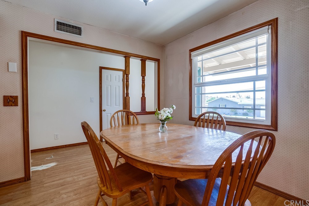 612 Lyford Drive La Verne, CA 91750 - Photo 9 of 44 a view of a a dining room with furniture window and wooden floor