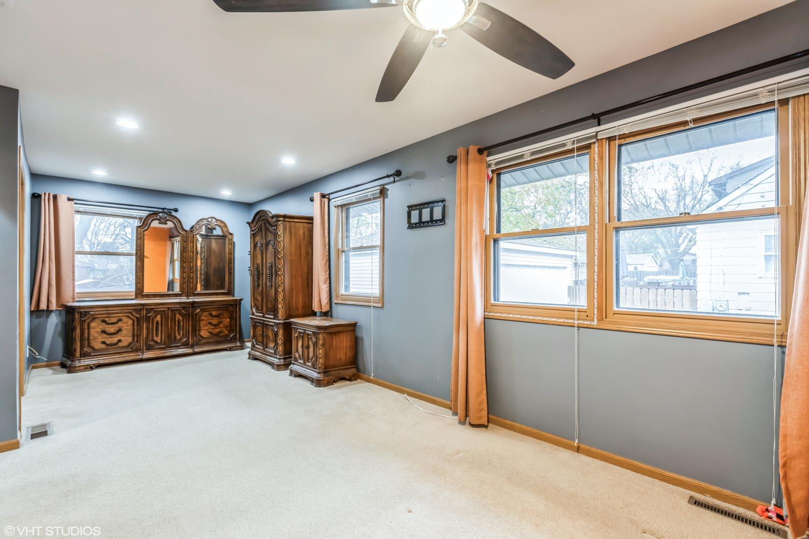 5 Hunters Path Lake In The Hills, IL 60156 - Photo 11 of 20 a spacious bedroom with a bed and a dresser next to a window